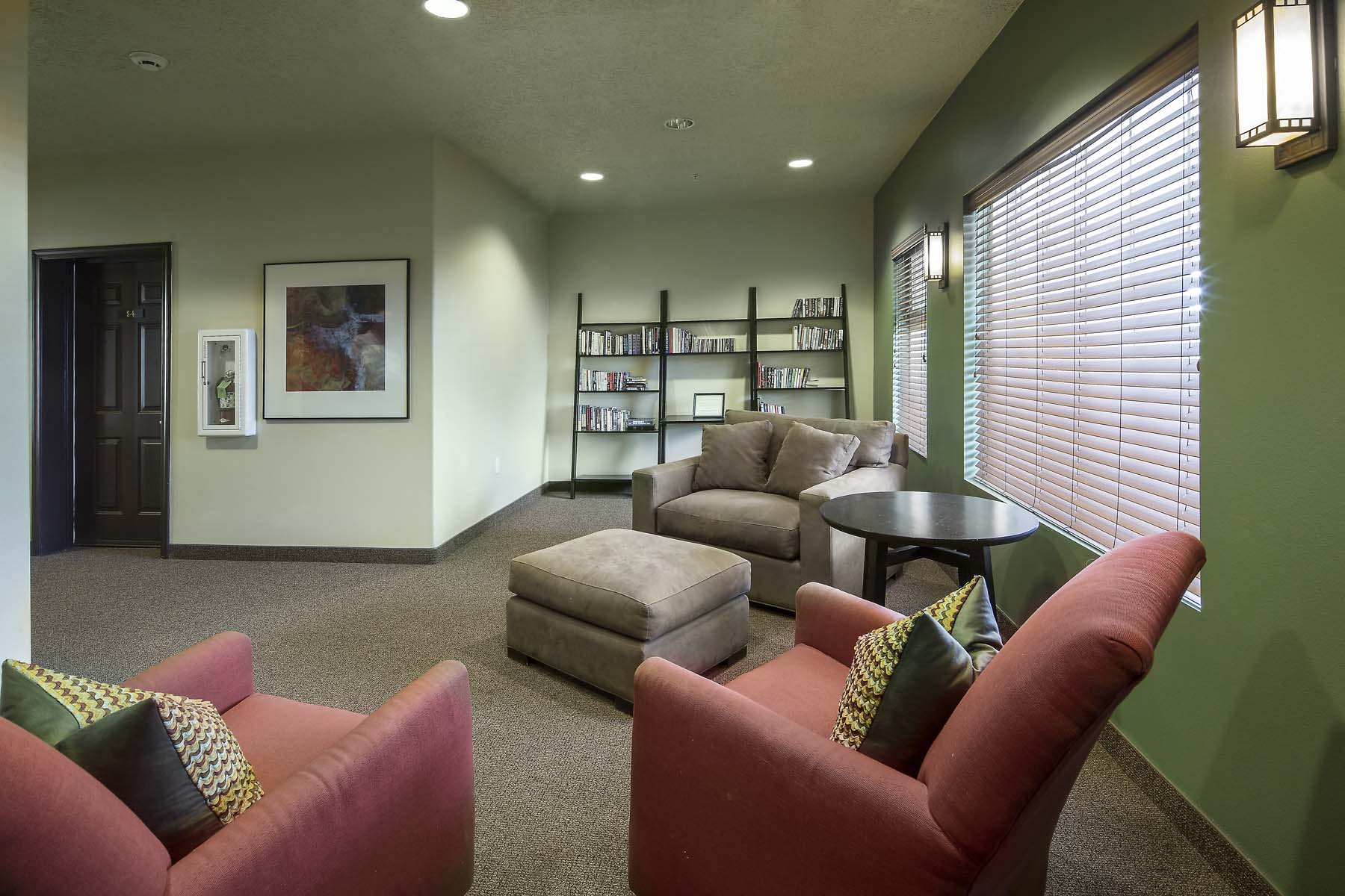 a living room with couches and chairs and a table