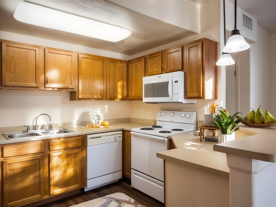 A kitchen with wooden cabinets and white appliances.