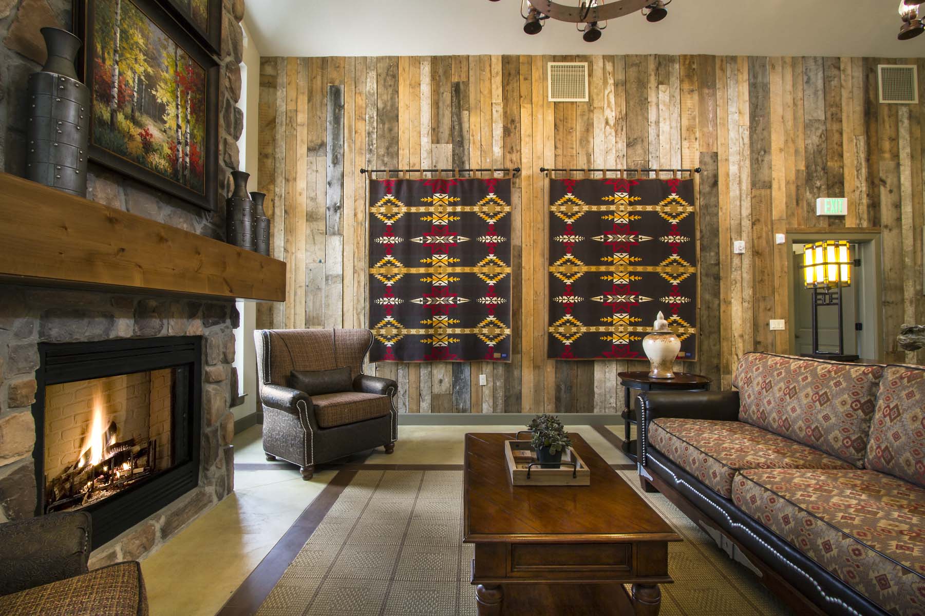 a living room with a fireplace and a coffee table