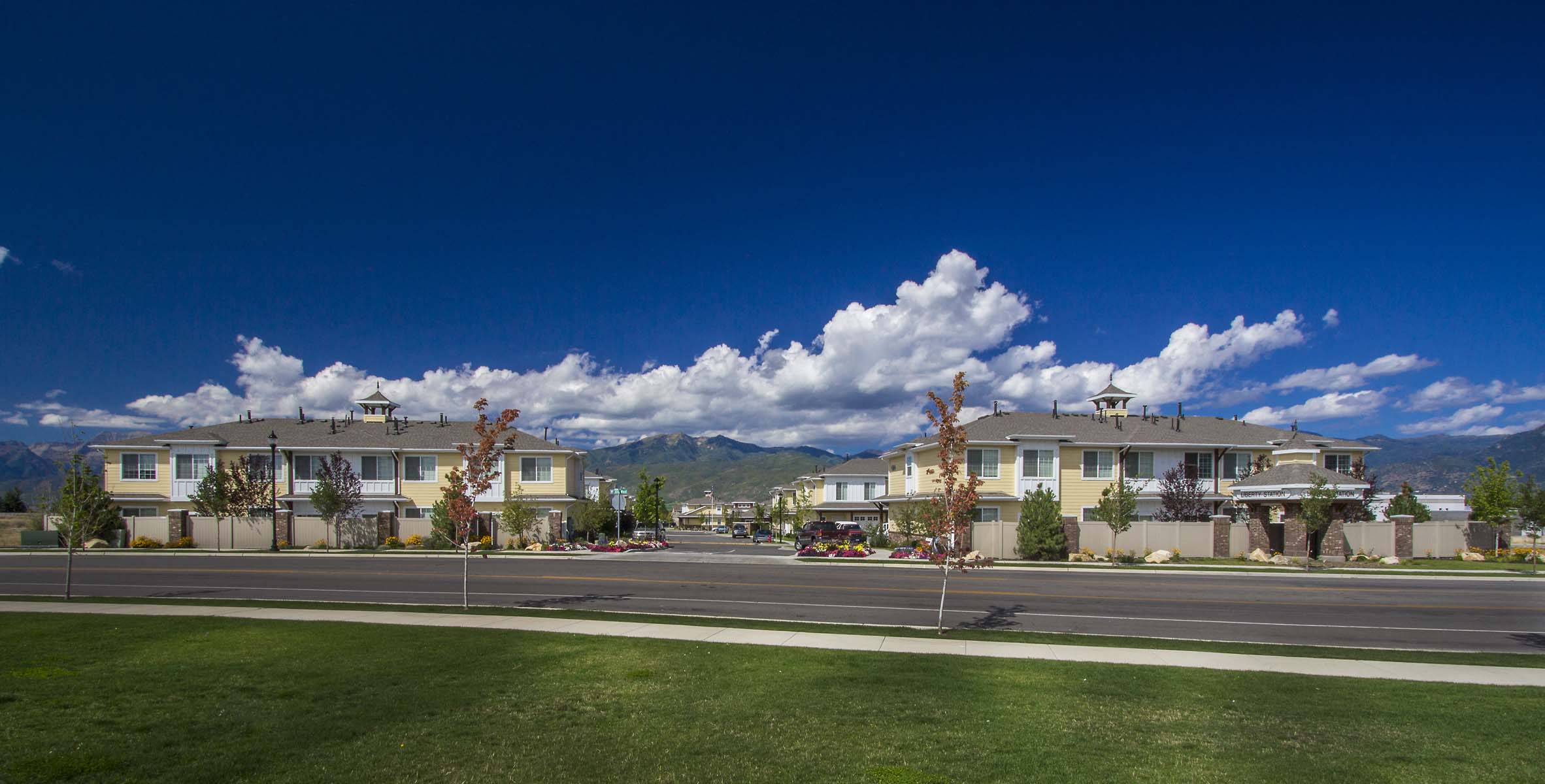 a row of houses on the side of a road