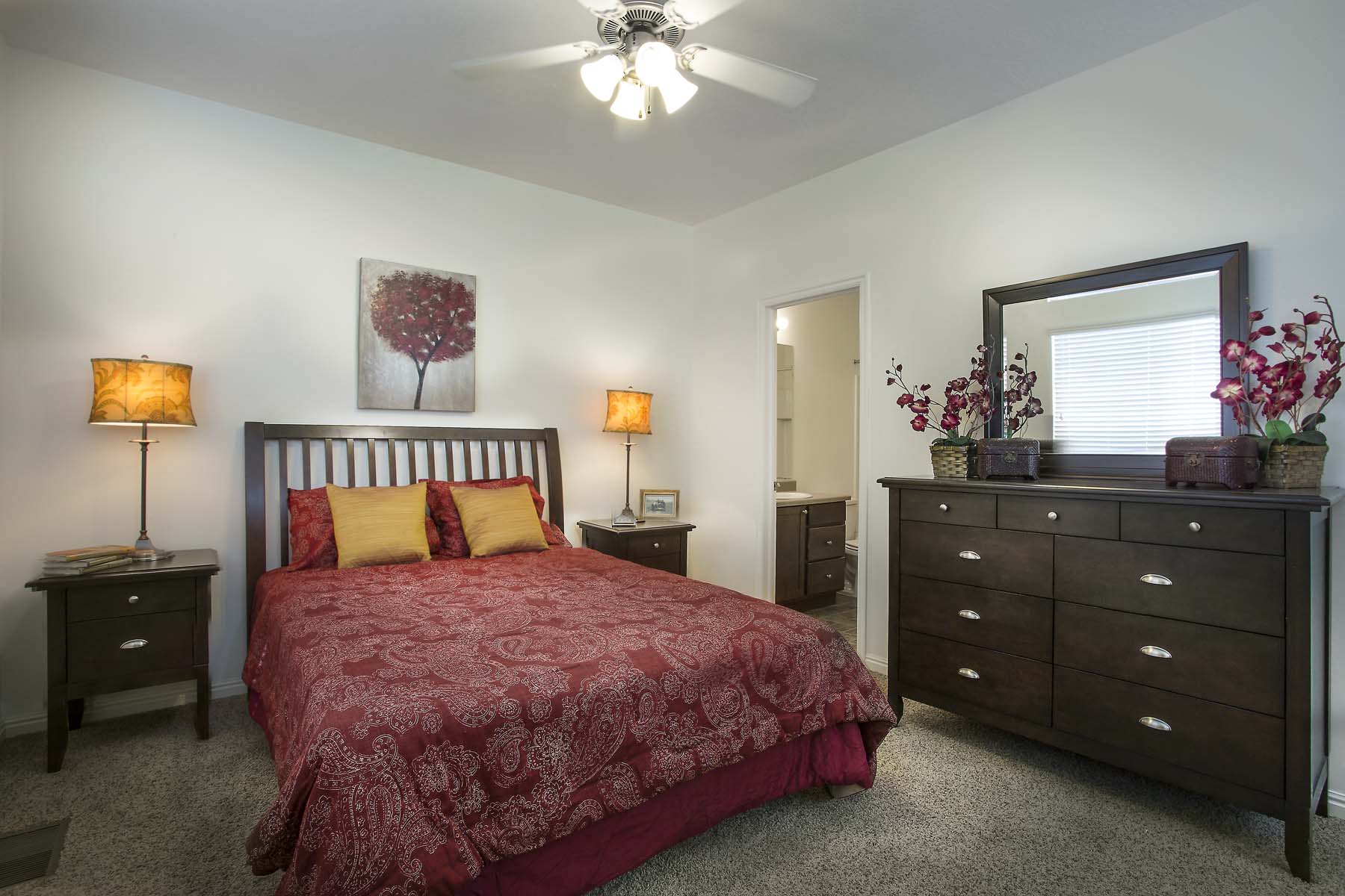 a bedroom with a bed and a dresser