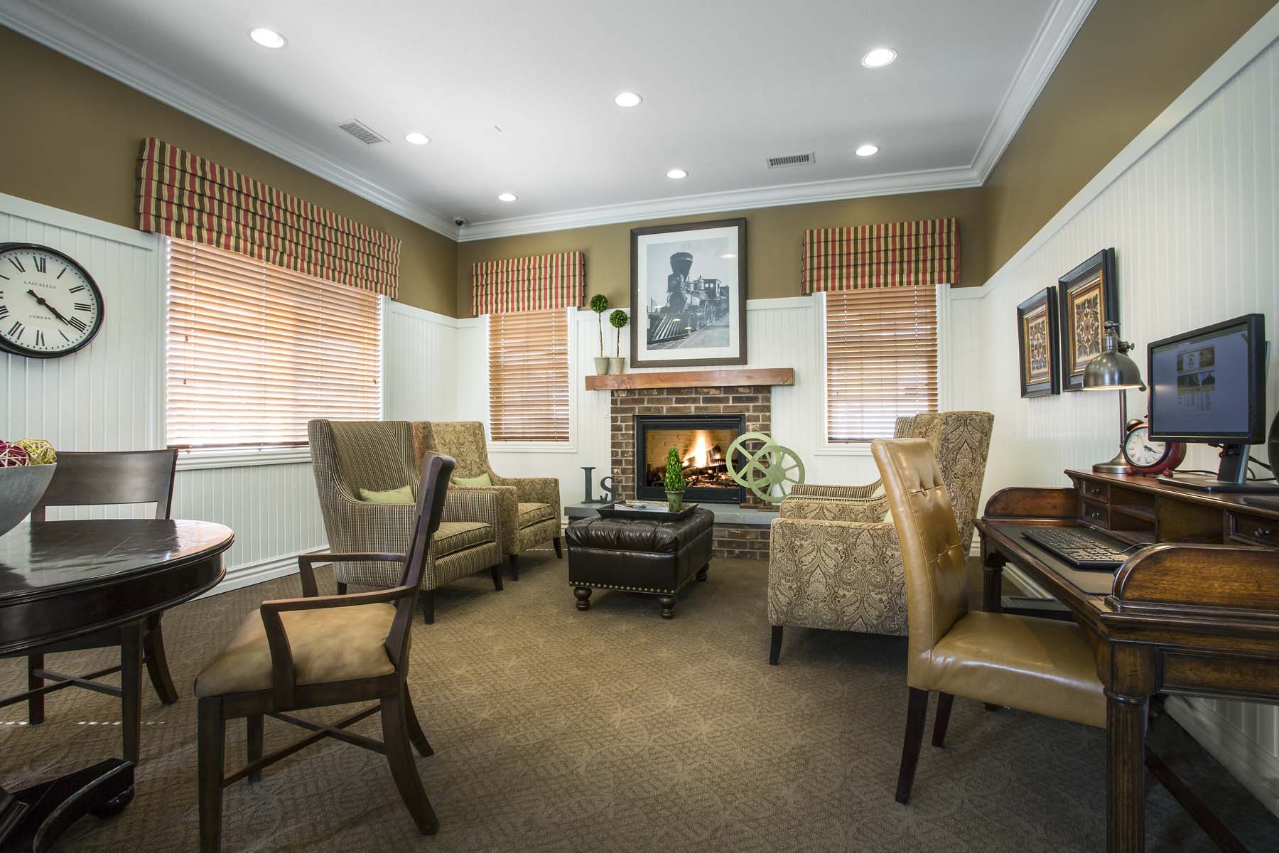 a living room with furniture and a fire place