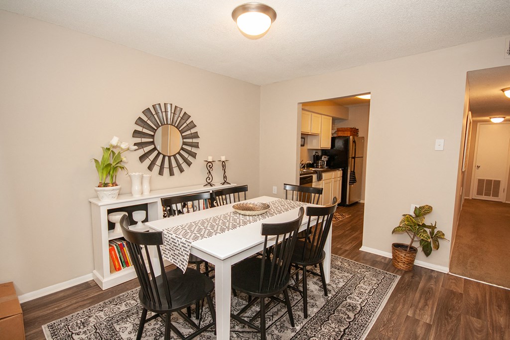 the view of a dining room with a table and chairs