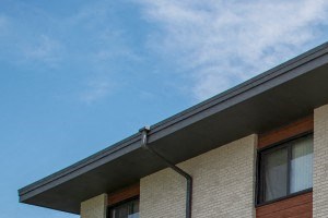 a picture of a building with a blue sky in the background