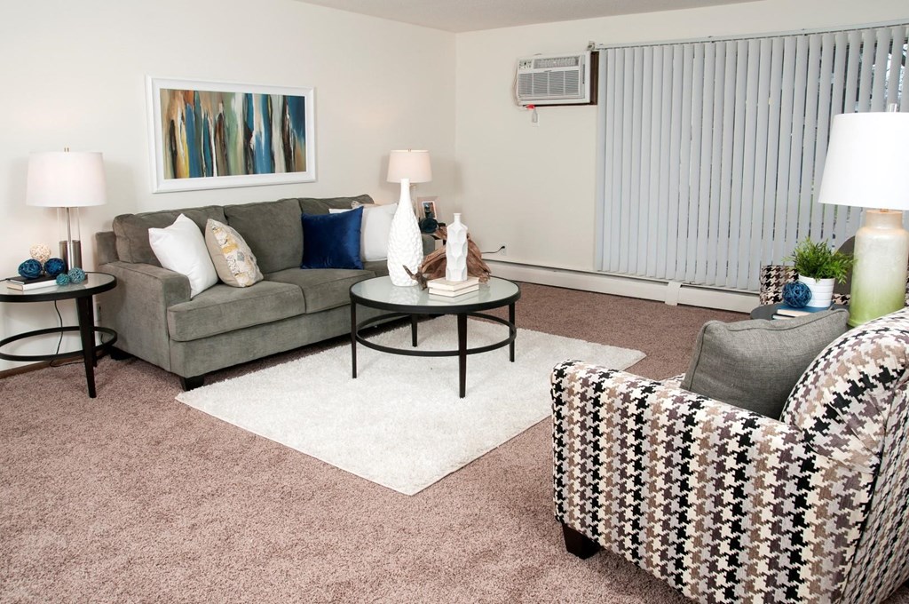 a living room with a couch and two chairs