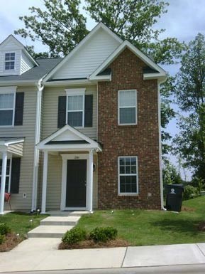 a house with a sidewalk in front of it
