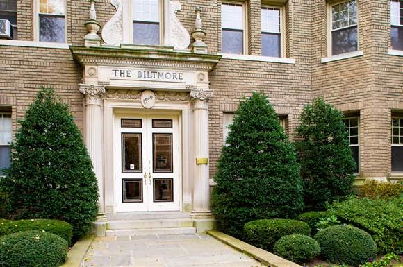 a large brick building with a white door