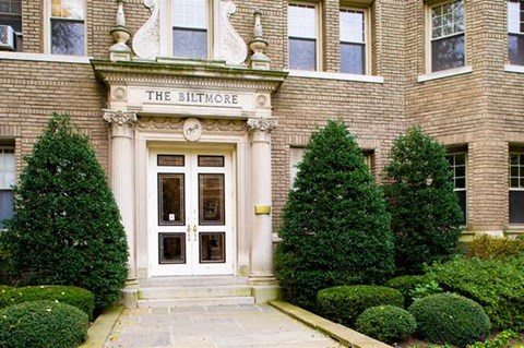 a large brick building with a white door