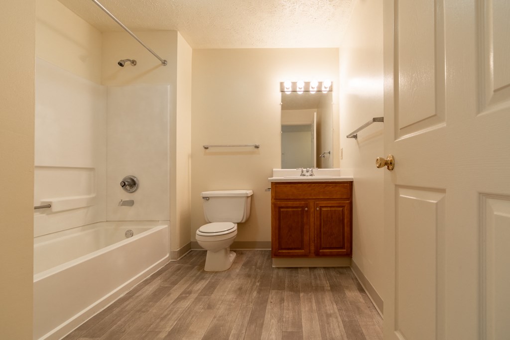 Large Soaking Tub In Master Bathroom With A Tile Surround at Bradford Place Apartments, Lafayette, IN