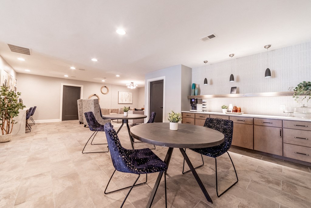 Tables and chairs in clubhouse at Governor Square Apartments, 1825 Jefferson Drive W, 46032
