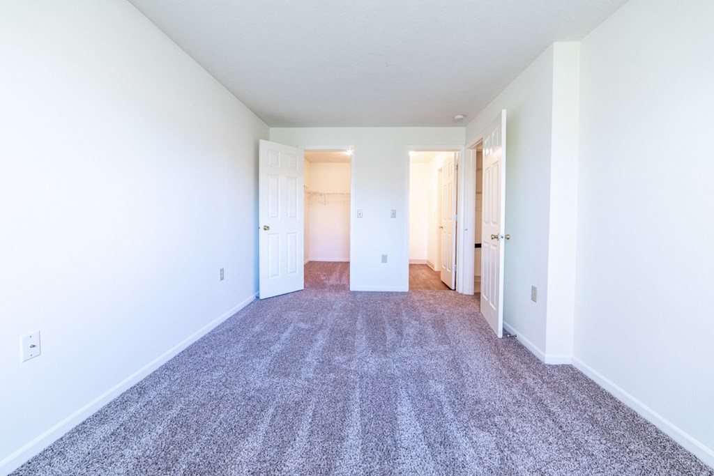 Bedroom with walk in closet at Bradford Run in Kokomo, IN