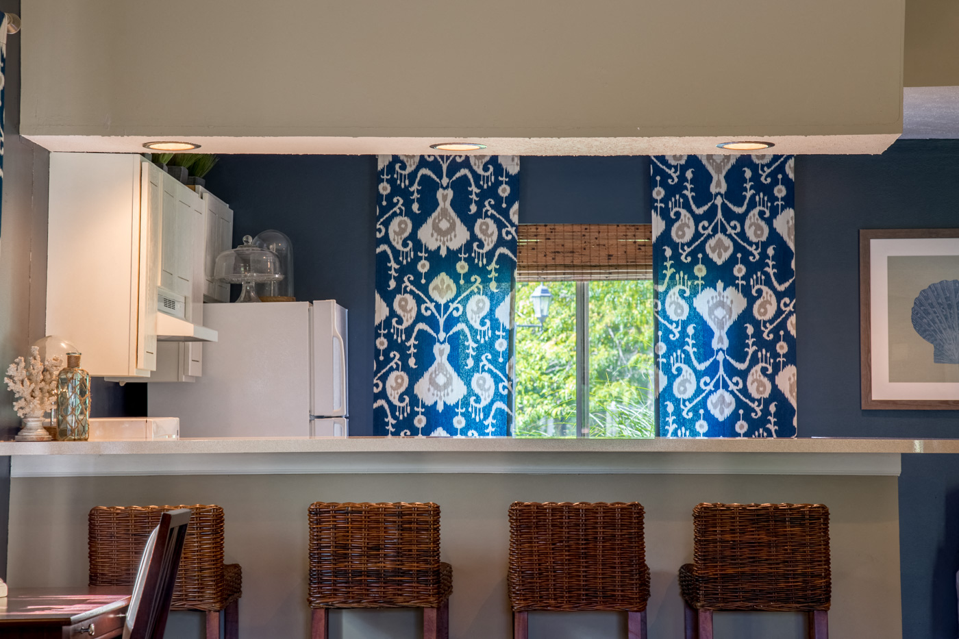 counter top in kitchen with blue curtains 