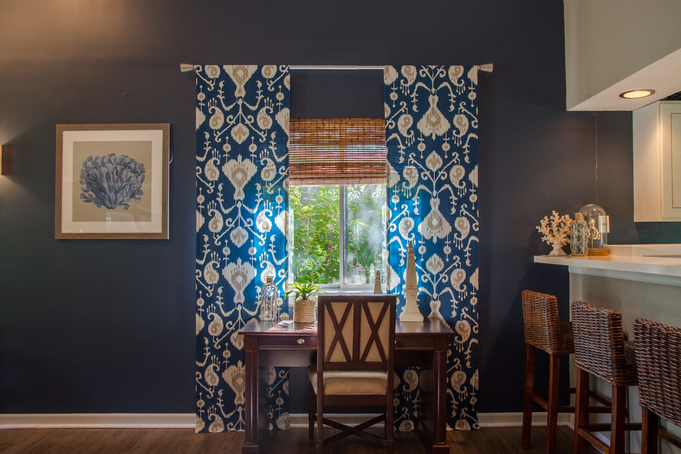 counter top in kitchen with blue curtains 
