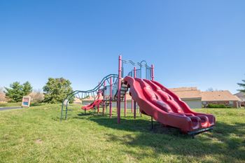 red playground in green space at Bradford Run in Kokomo, IN