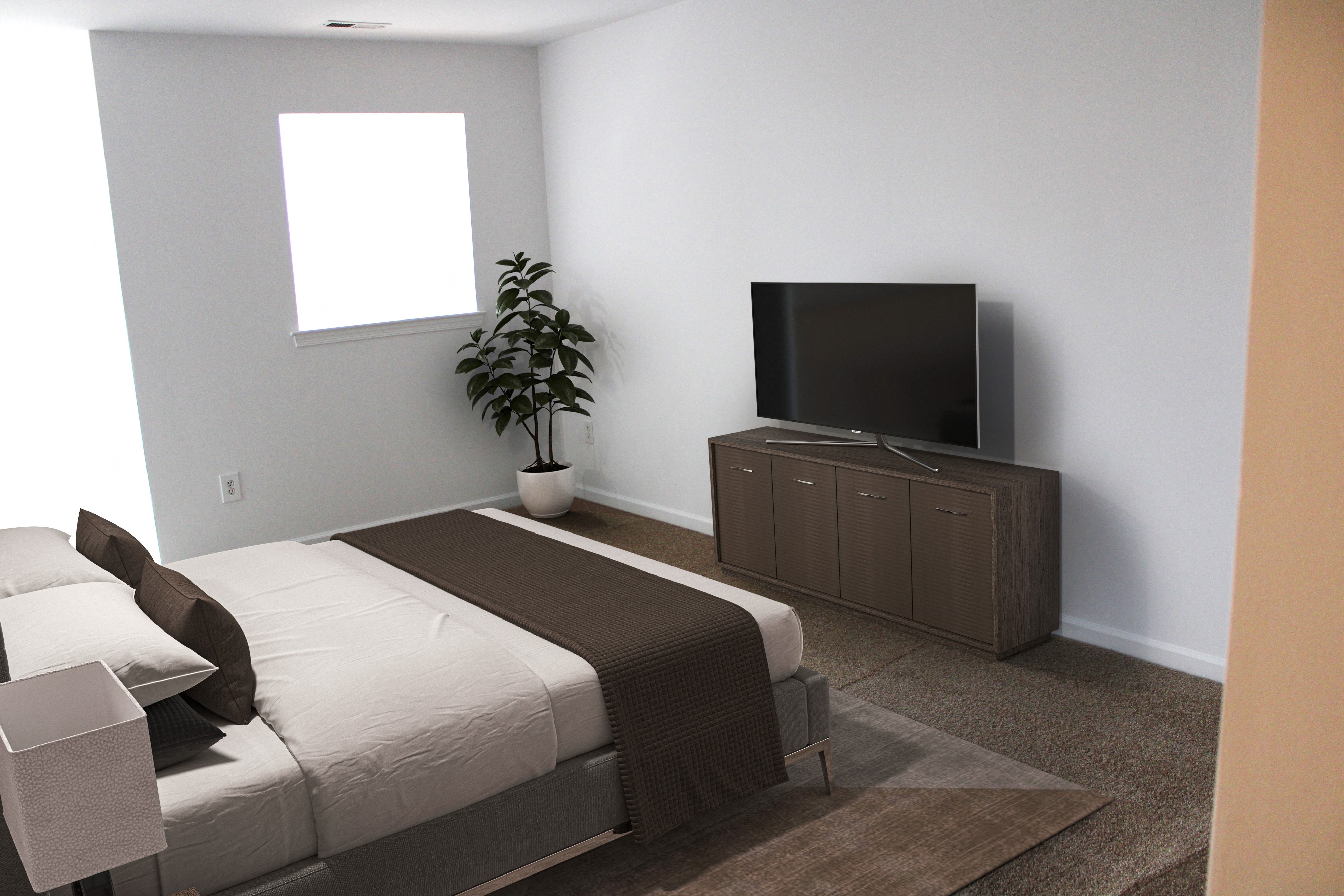 a bedroom with a bed and a television