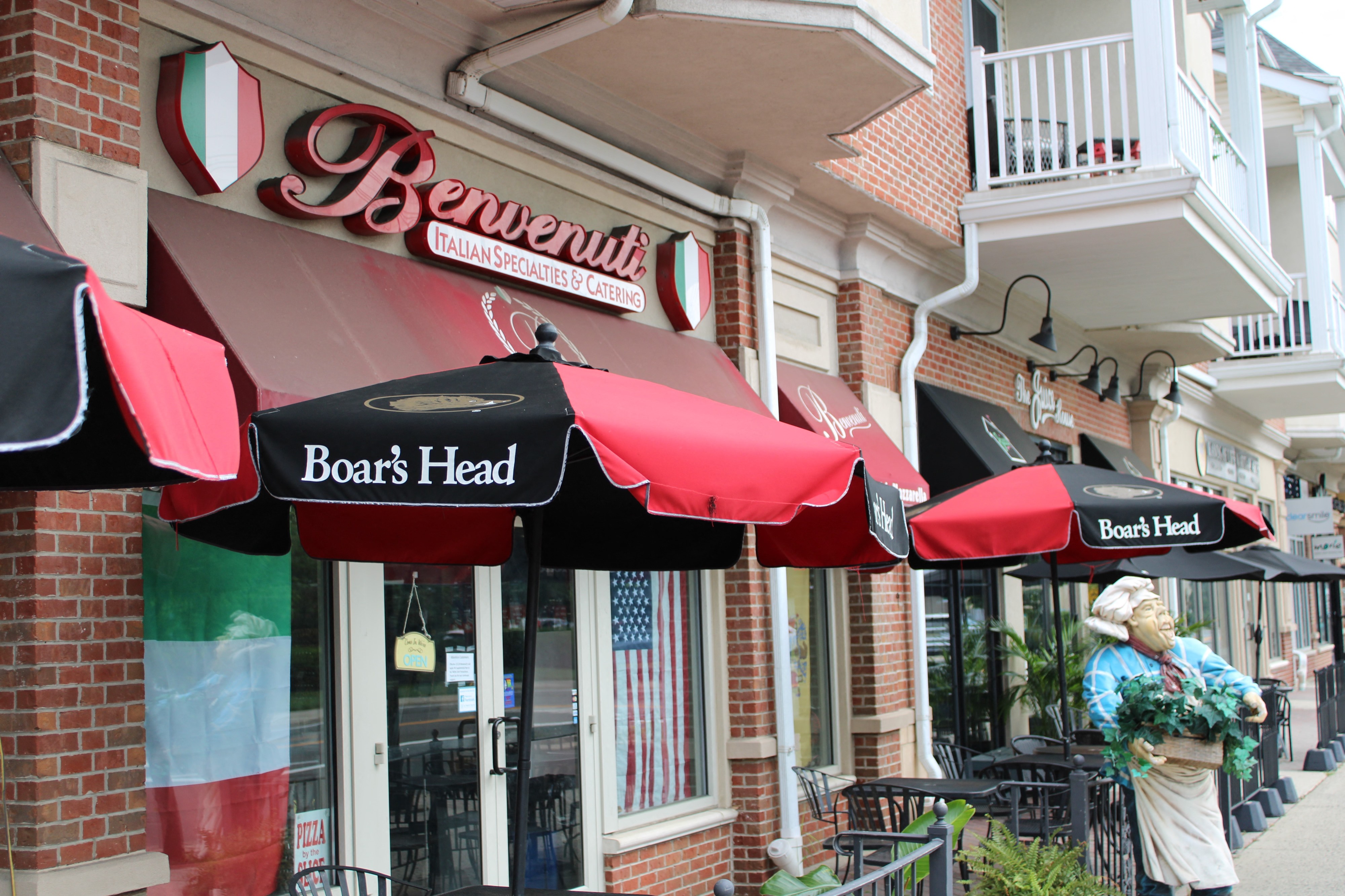 a row of umbrellas in front of a restaurant