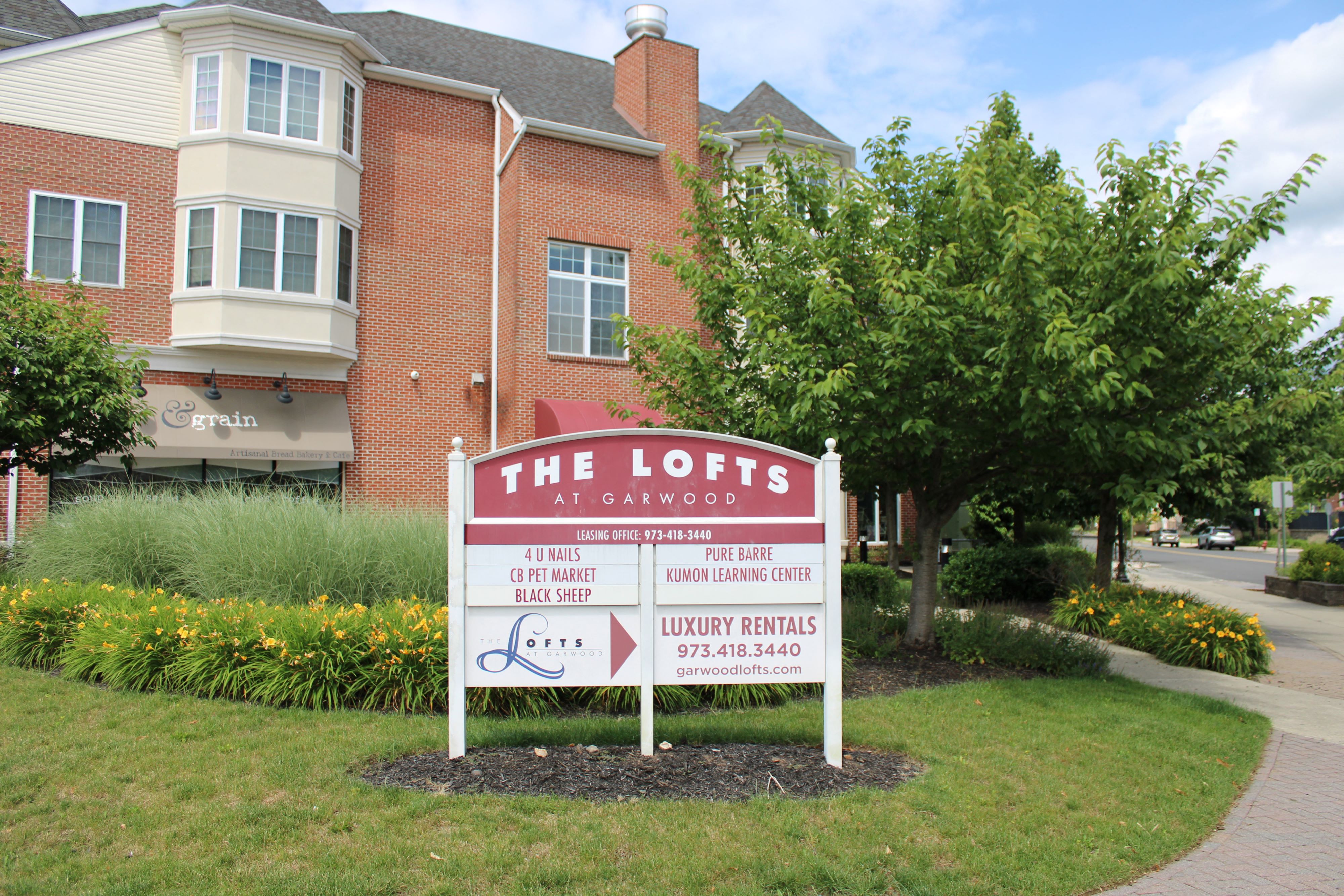 the lofts at canyons sign in front of a building