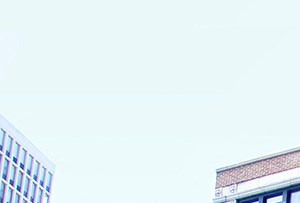 a brick building on the corner of a city street