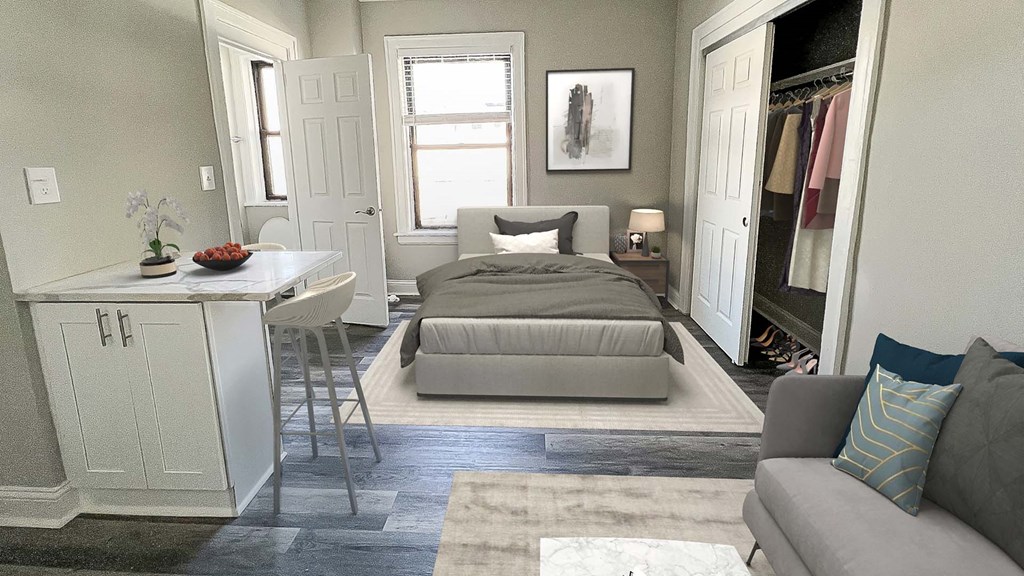 a bedroom with a bed and a desk and a closet