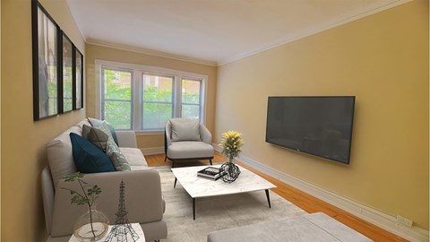 a living room with a couch and two chairs and a television