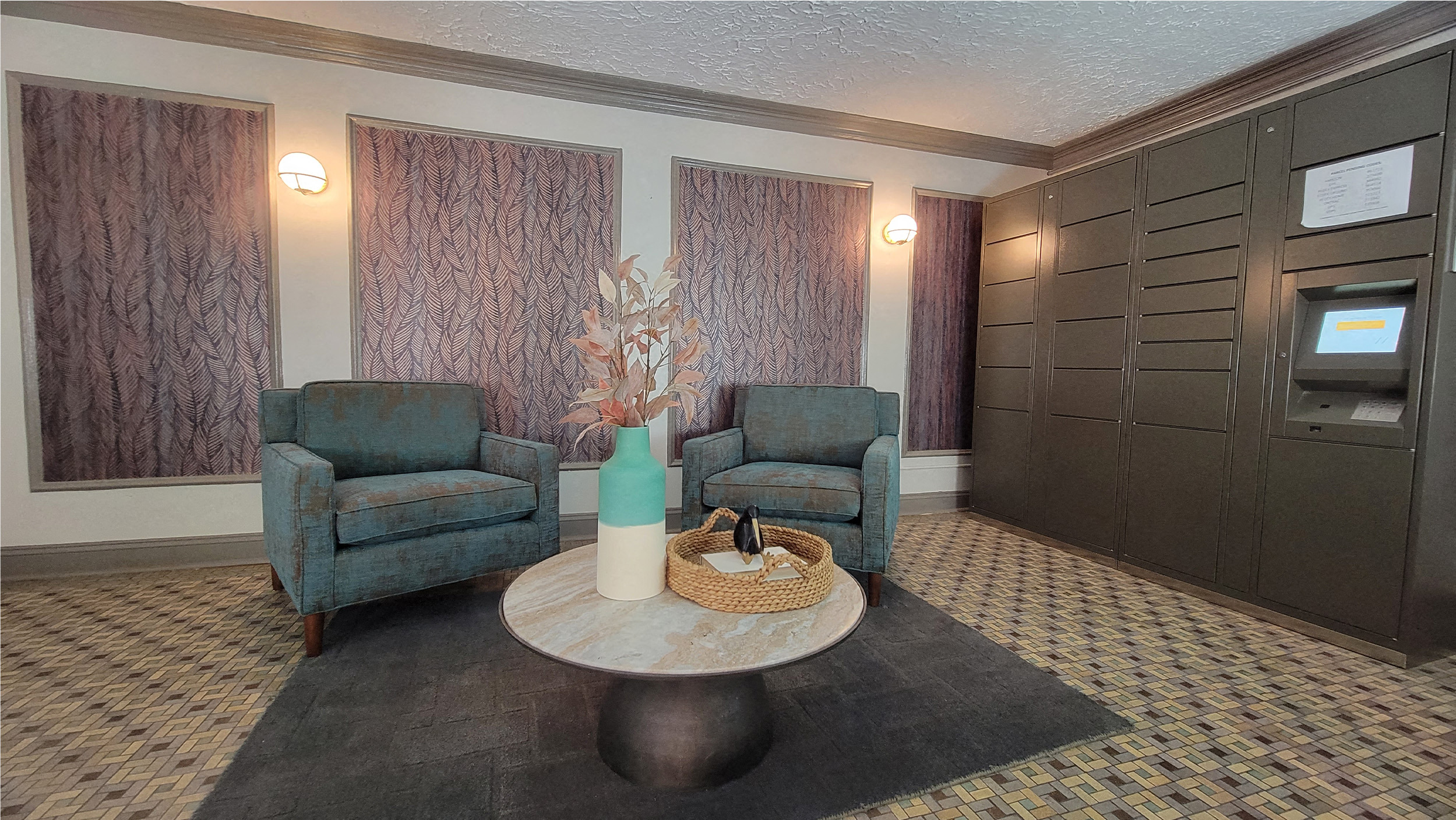 a living room with two blue chairs and a table