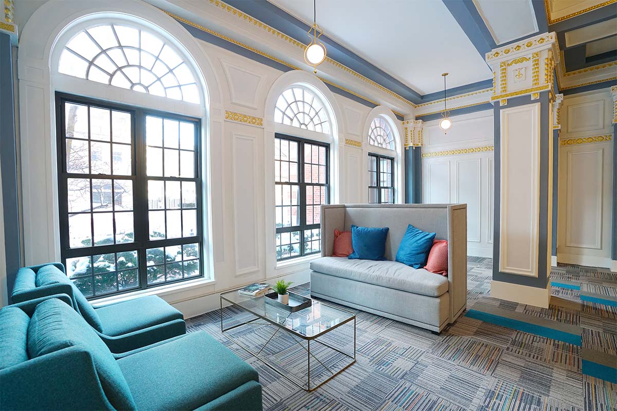 a living room with blue couches and a coffee table