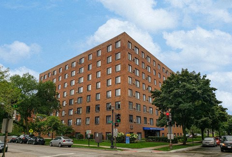 a tall brick building sitting on the corner of a street