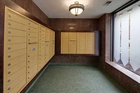 a locker room with wooden lockers and a window