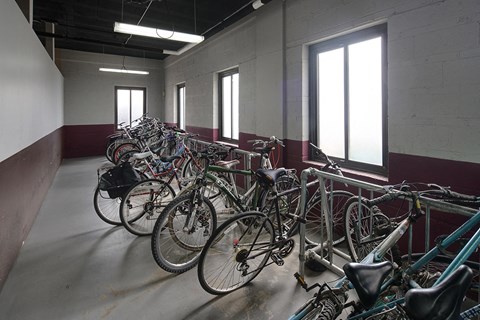 a bunch of bikes parked in a room