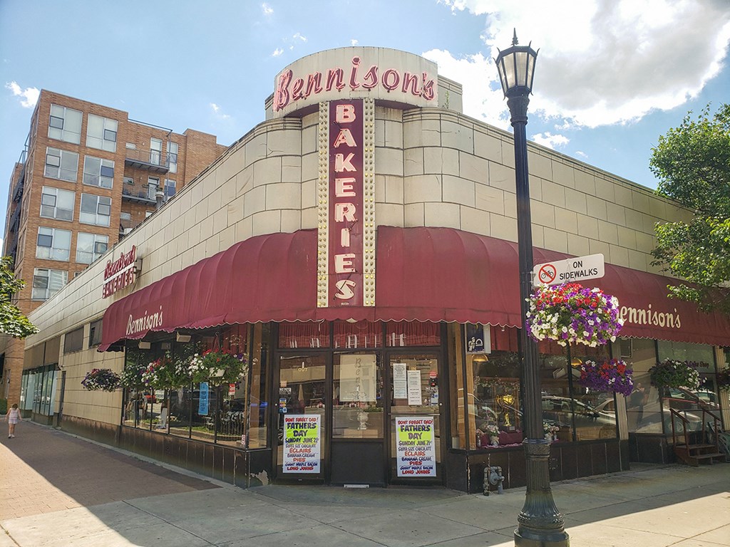 a building with a sign on top of it on a city street