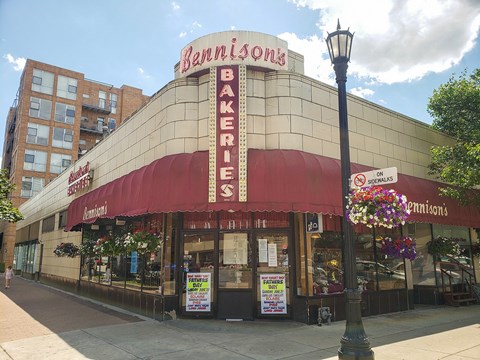 a building with a sign on top of it on a city street