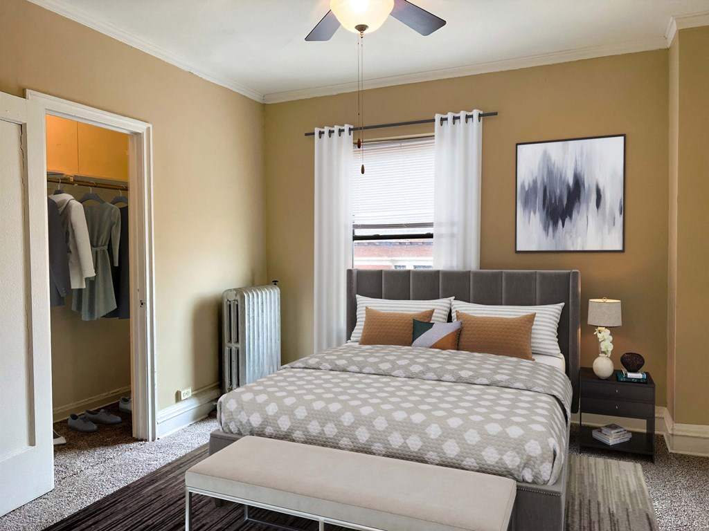 a bedroom with a bed and a closet