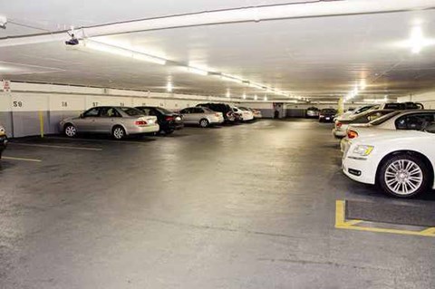 a parking garage filled with lots of cars
