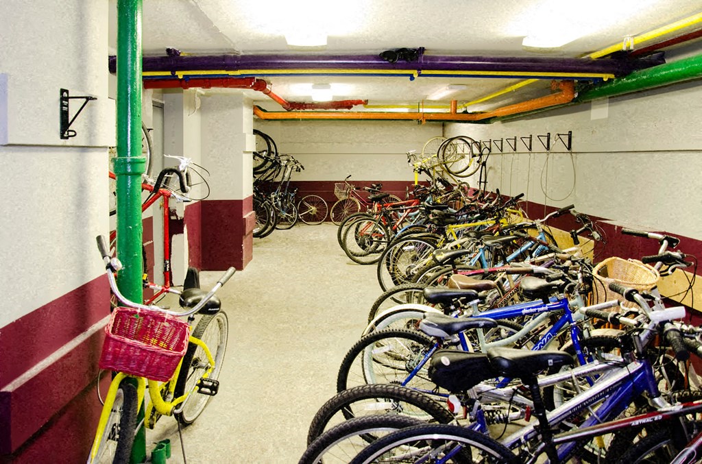 a bunch of bikes parked in a room