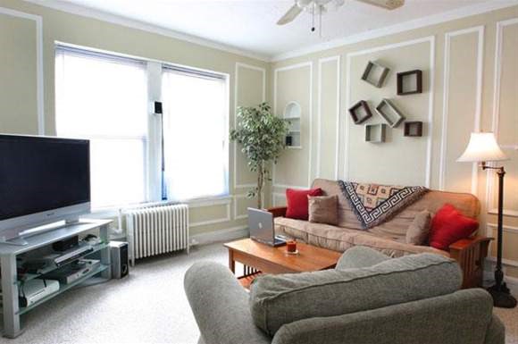 a living room with a couch and a tv