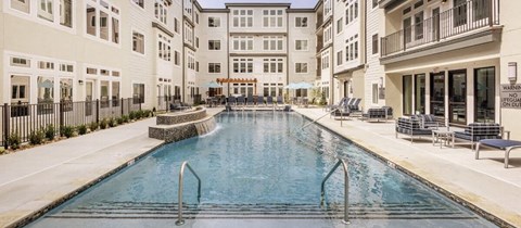 a swimming pool in the middle of an apartment building