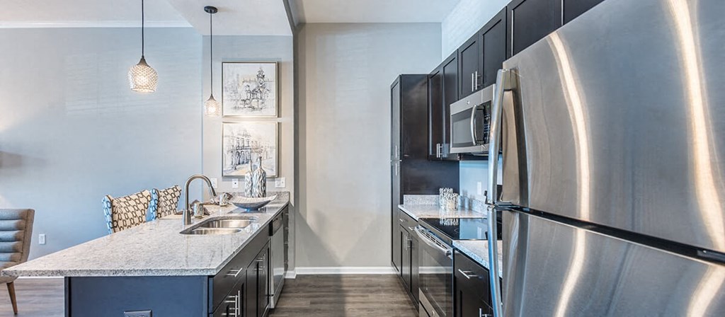 a kitchen with stainless steel appliances and a counter top