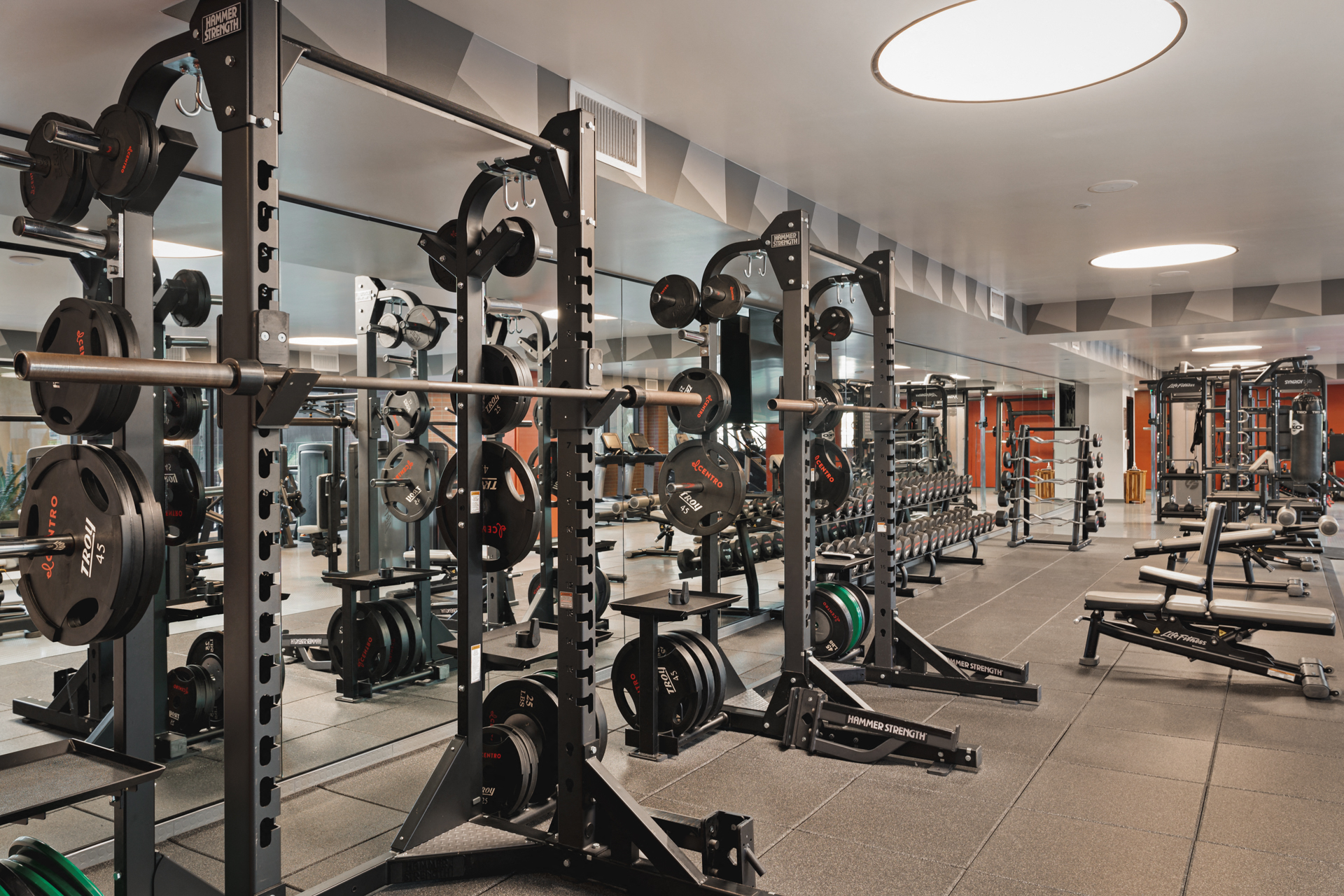 a row of weights machines in a gym