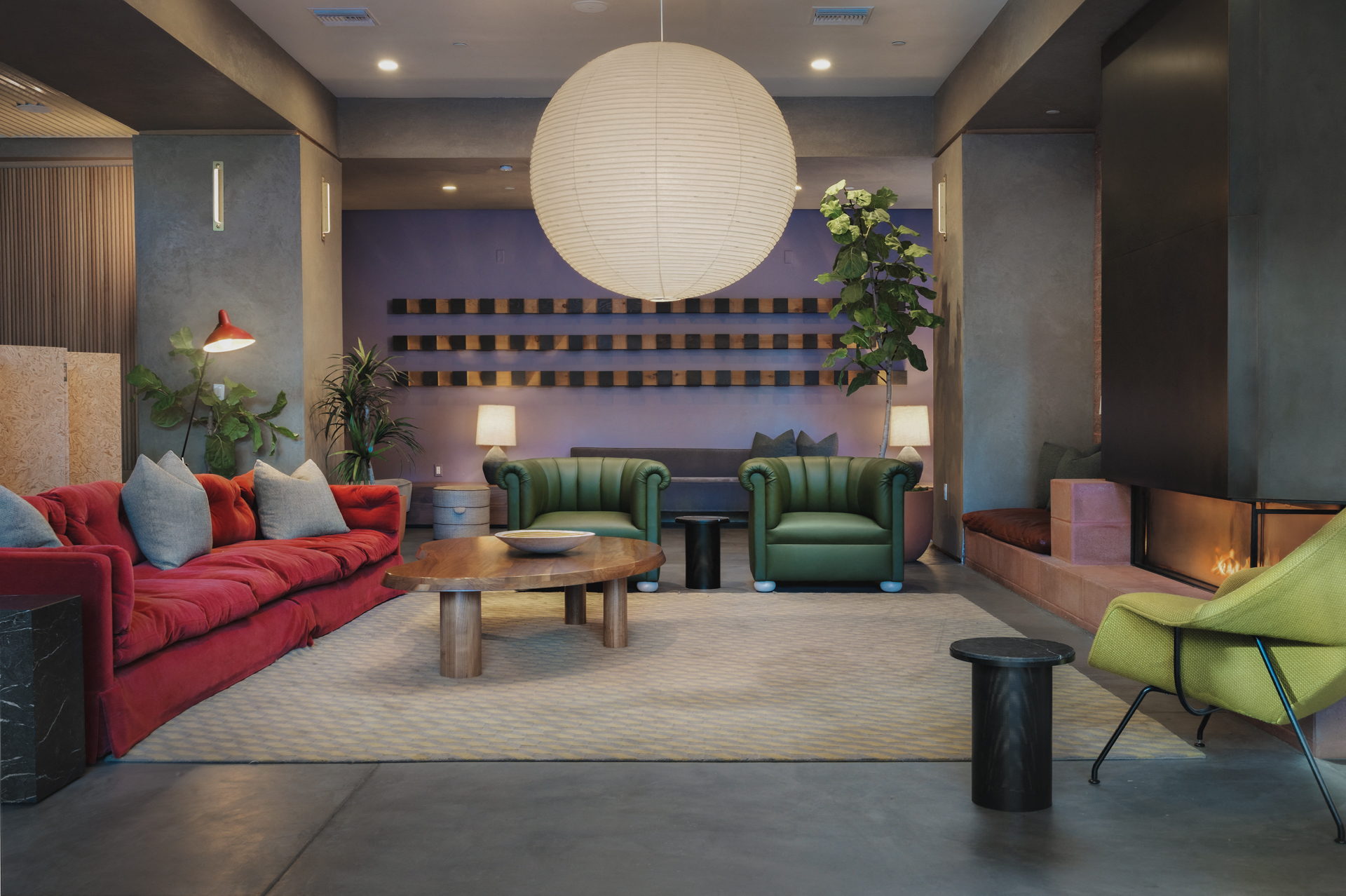 a living room with couches and chairs and a table