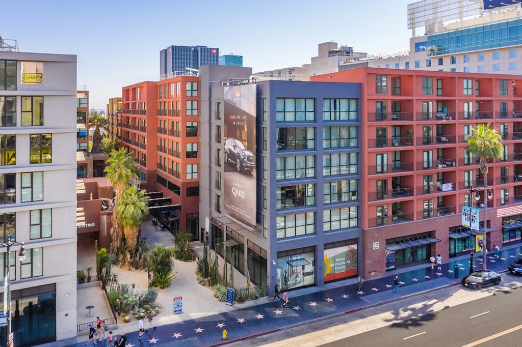 a city street with a building with a large billboard on it