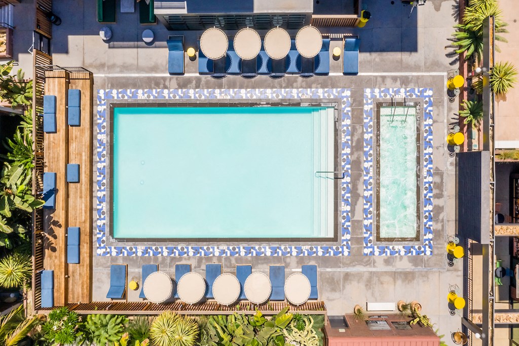 a view of a pool from the top of a building