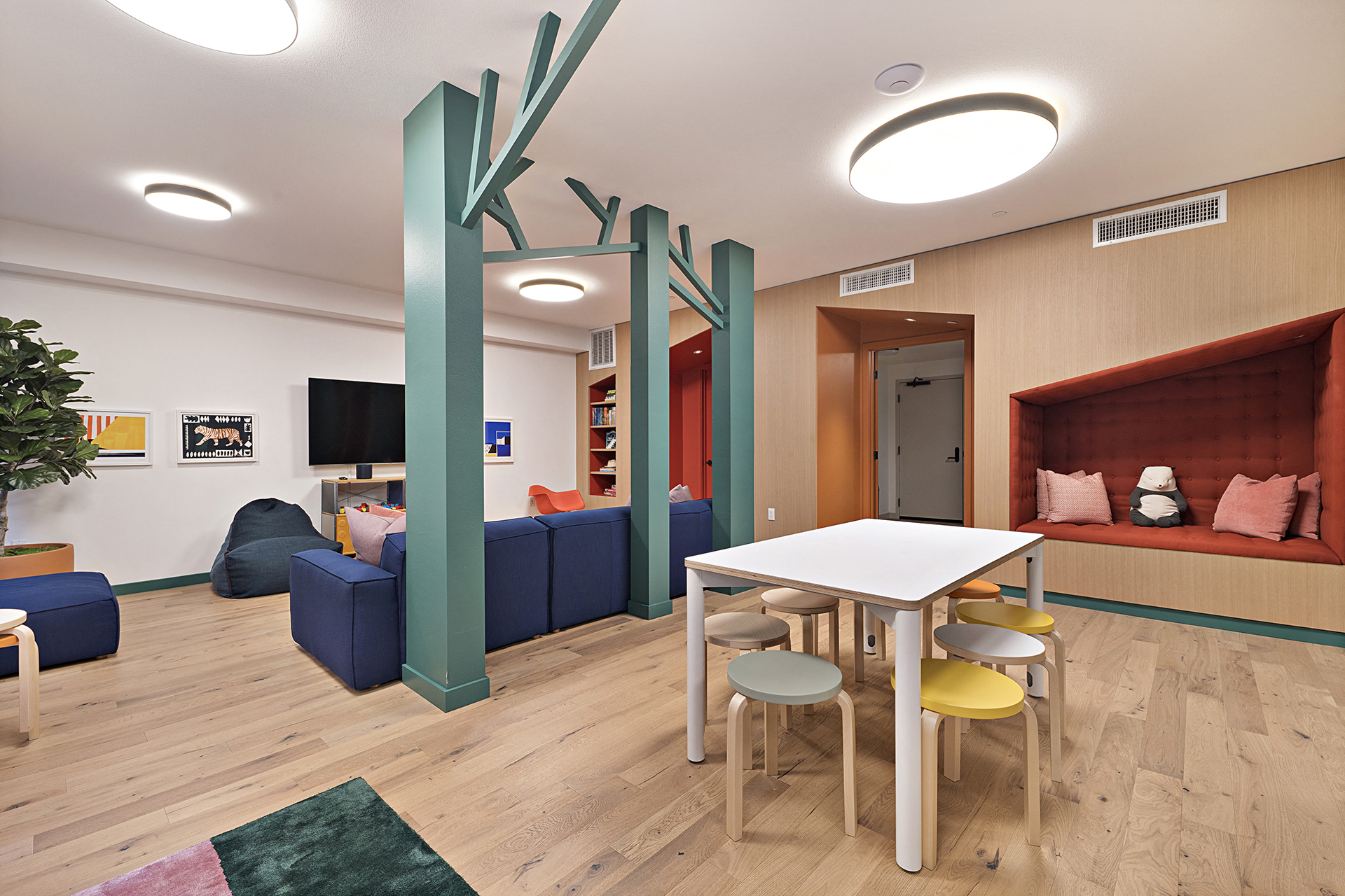 a living room with a table and chairs