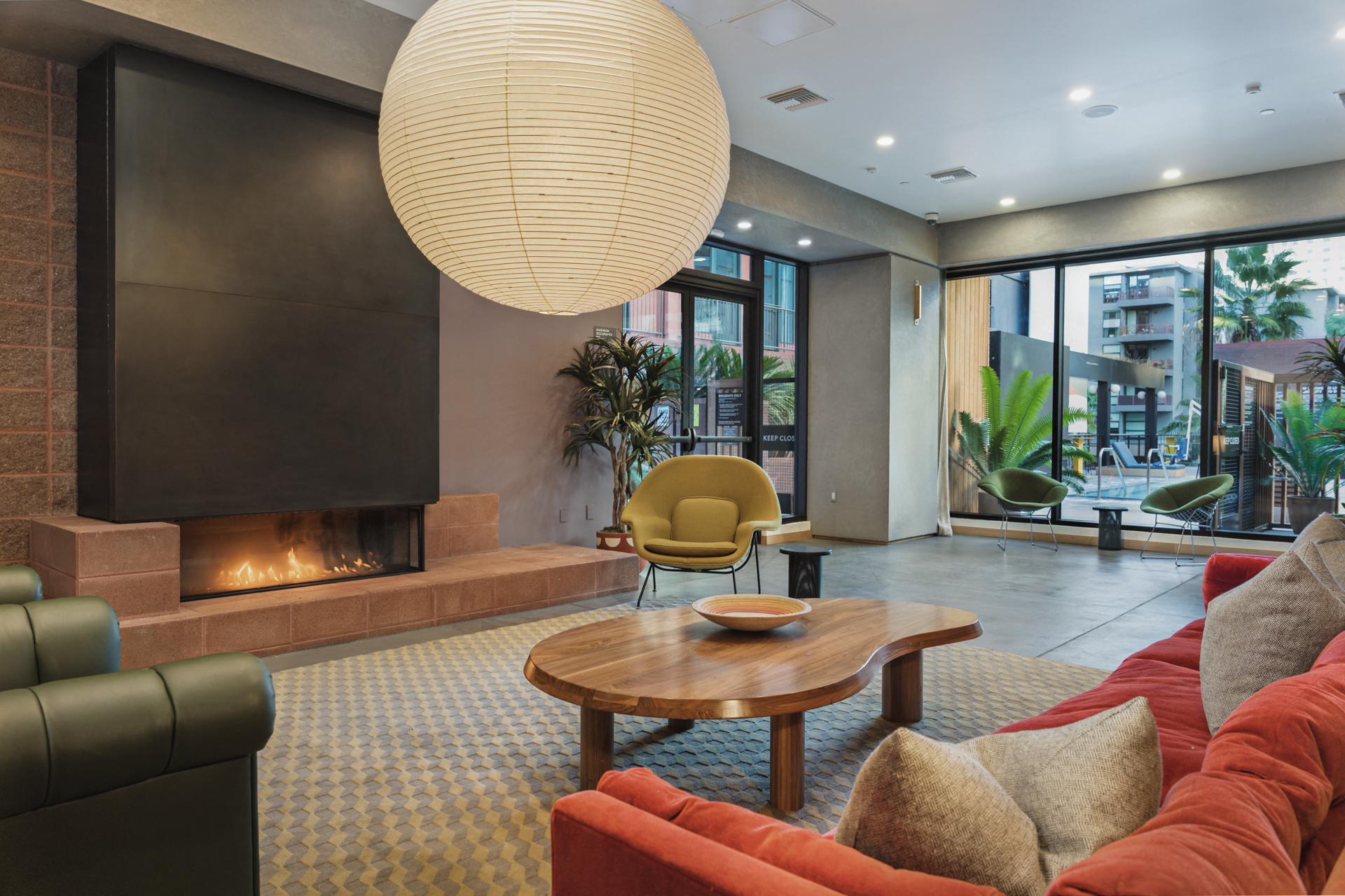 a living room with couches and a coffee table and a fireplace