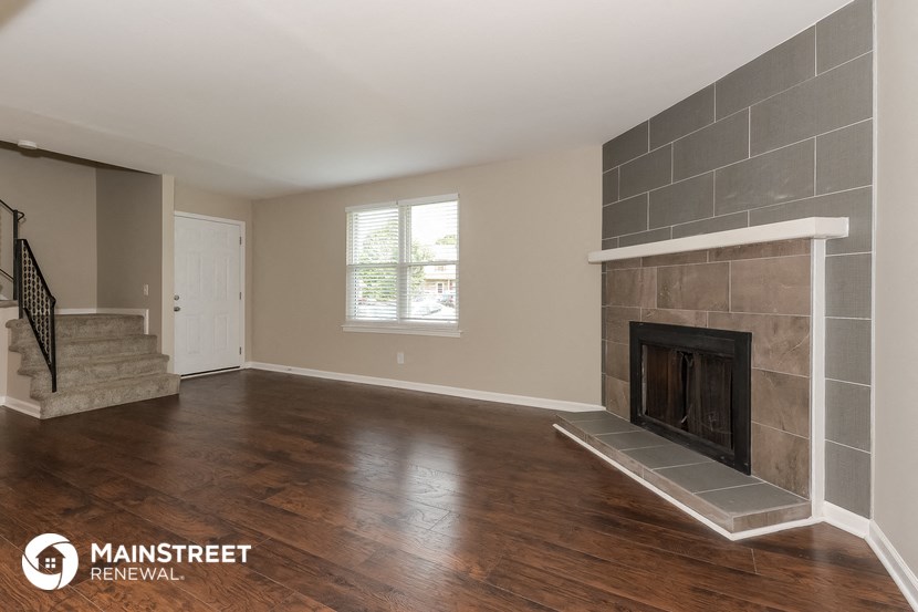 the living room of a home with a fireplace