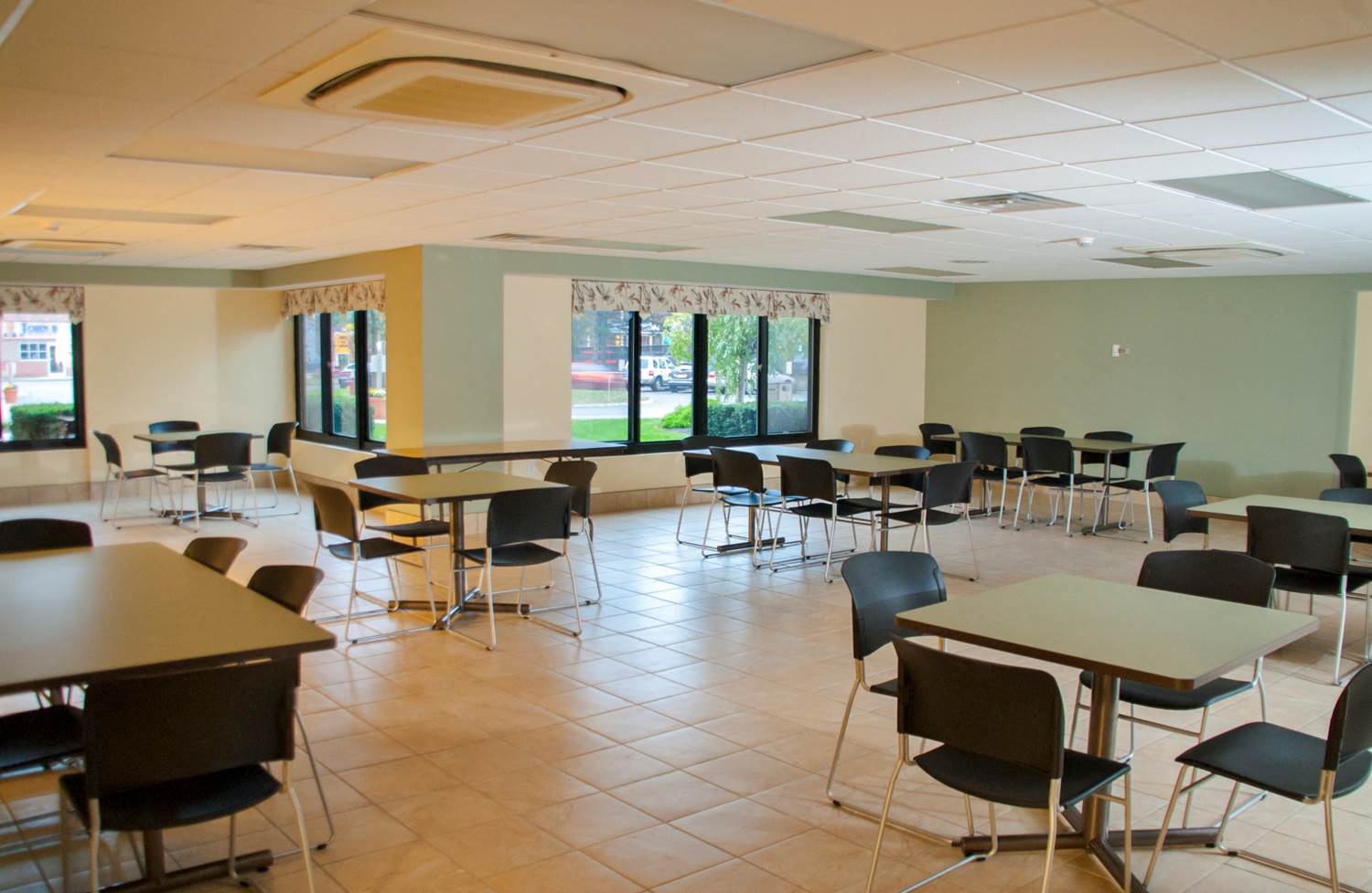 a dining room with tables and chairs