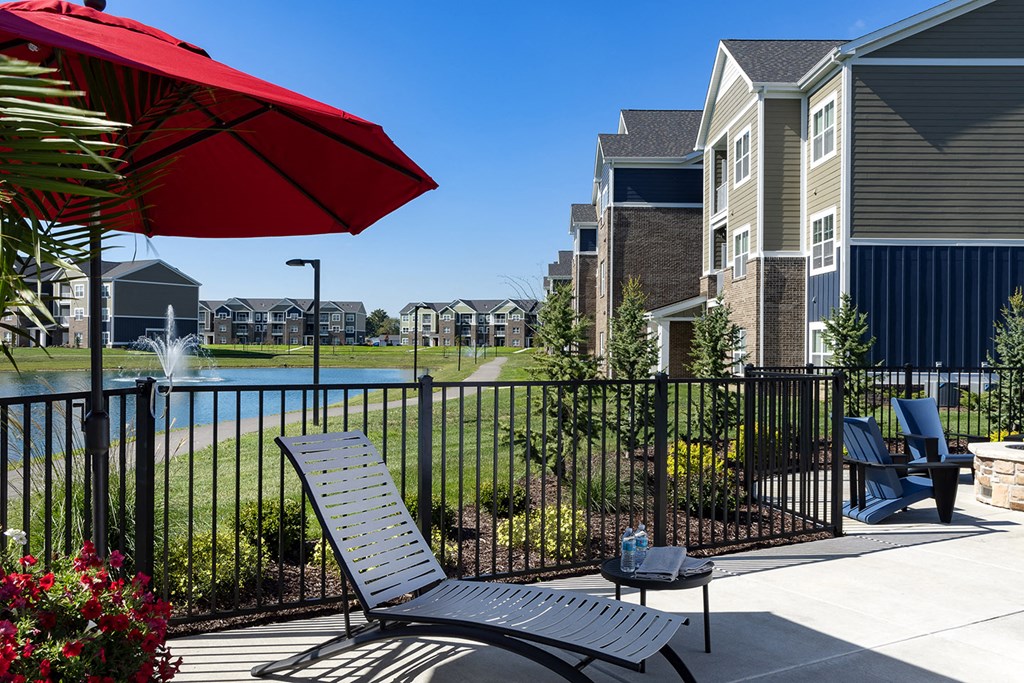 lounge chair under umbrella at Thirteen01 at Hartman Lakes, Shiloh, Illinois
