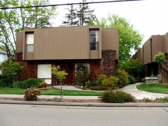 a house with a sidewalk in front of it