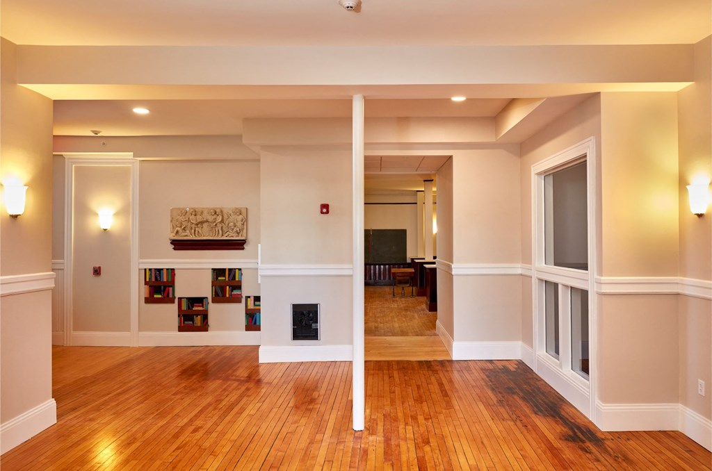 the living room and dining room of a renovated house