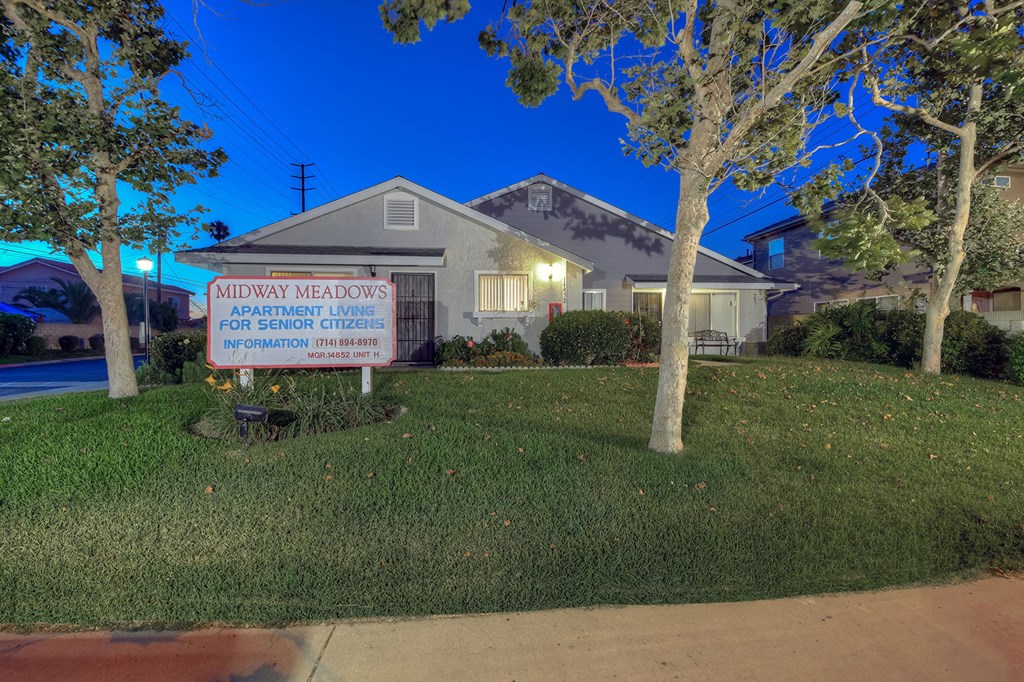 a house with a foreclosure sign in front of it