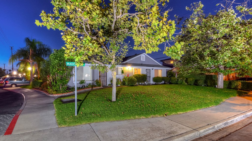 a house with a street sign in front of it